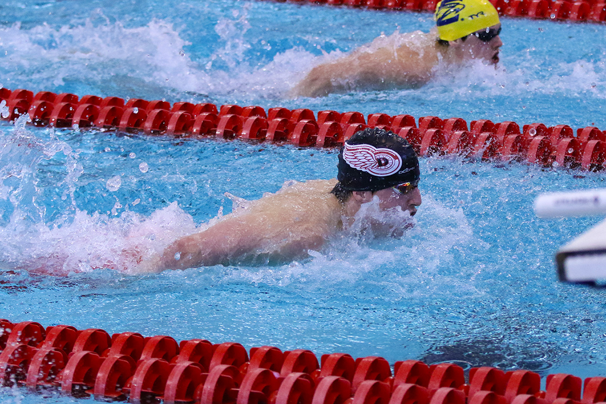 Denison student athletes competitively swimming