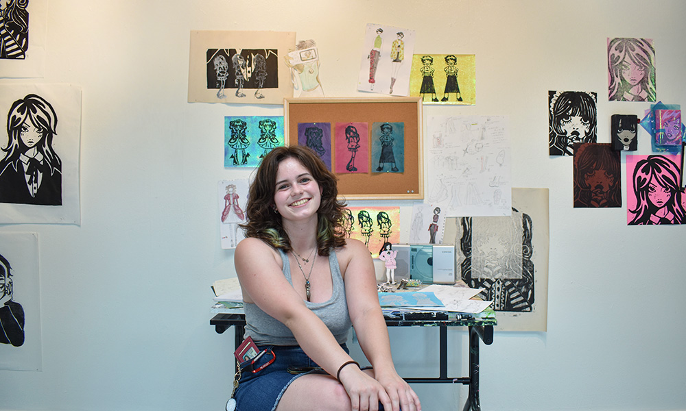 Ellie Schrader '23 with her artwork