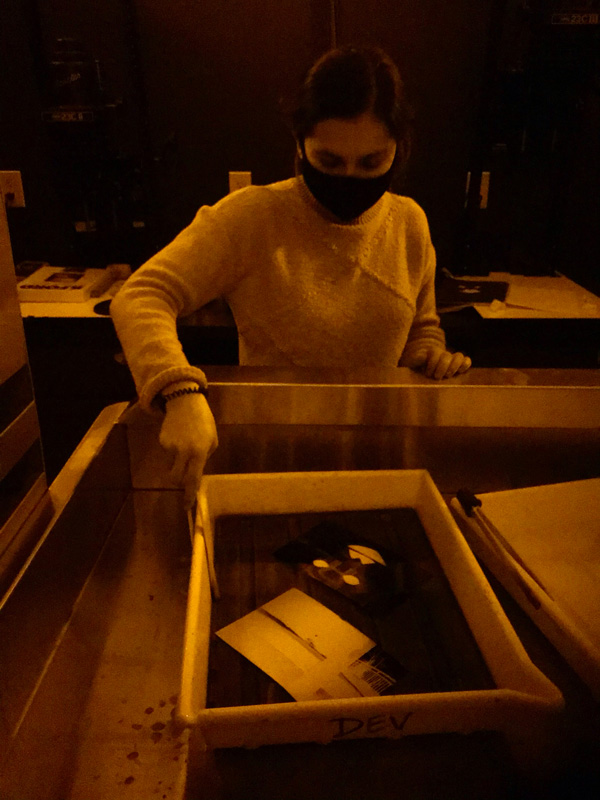 Student developing images in the darkroom