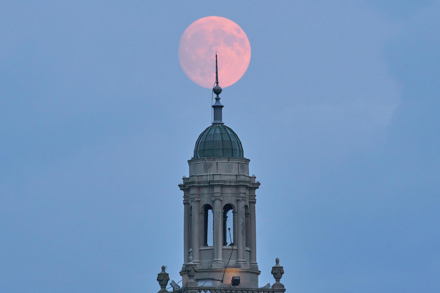 The moon rises over Swasey. Photo by Tim Black