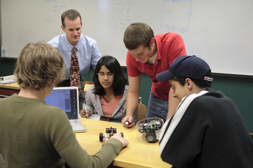 Students working with a robot
