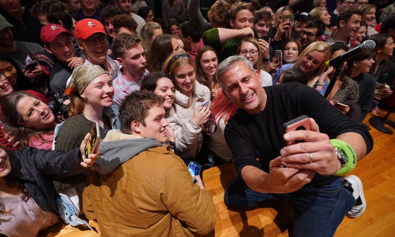 Steve Carell taking a selfie with the audience at Swasey Chapel