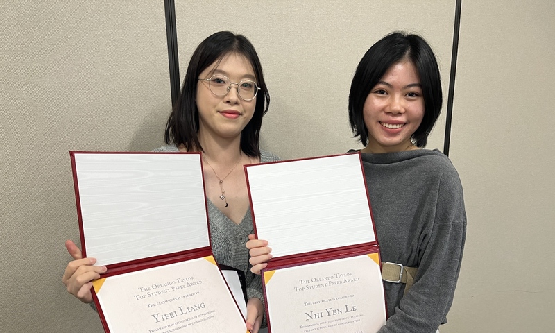 Yifei Liang and Nhi Yen Le holding their awards