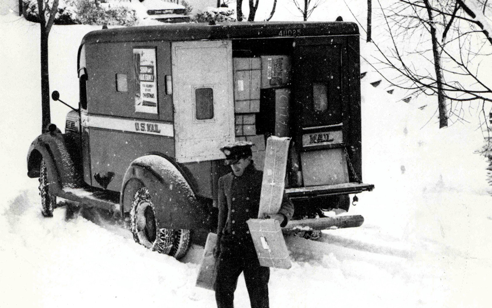 Come rain or shine or absurd amounts of snow, members of the postal service (like this postman from 1950) have done their best to make sure holiday packages reach their destinations.
