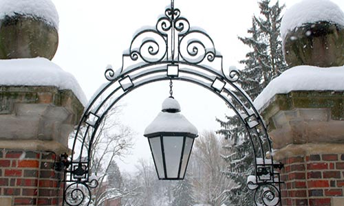 Photo of a campus gate with snow in winter