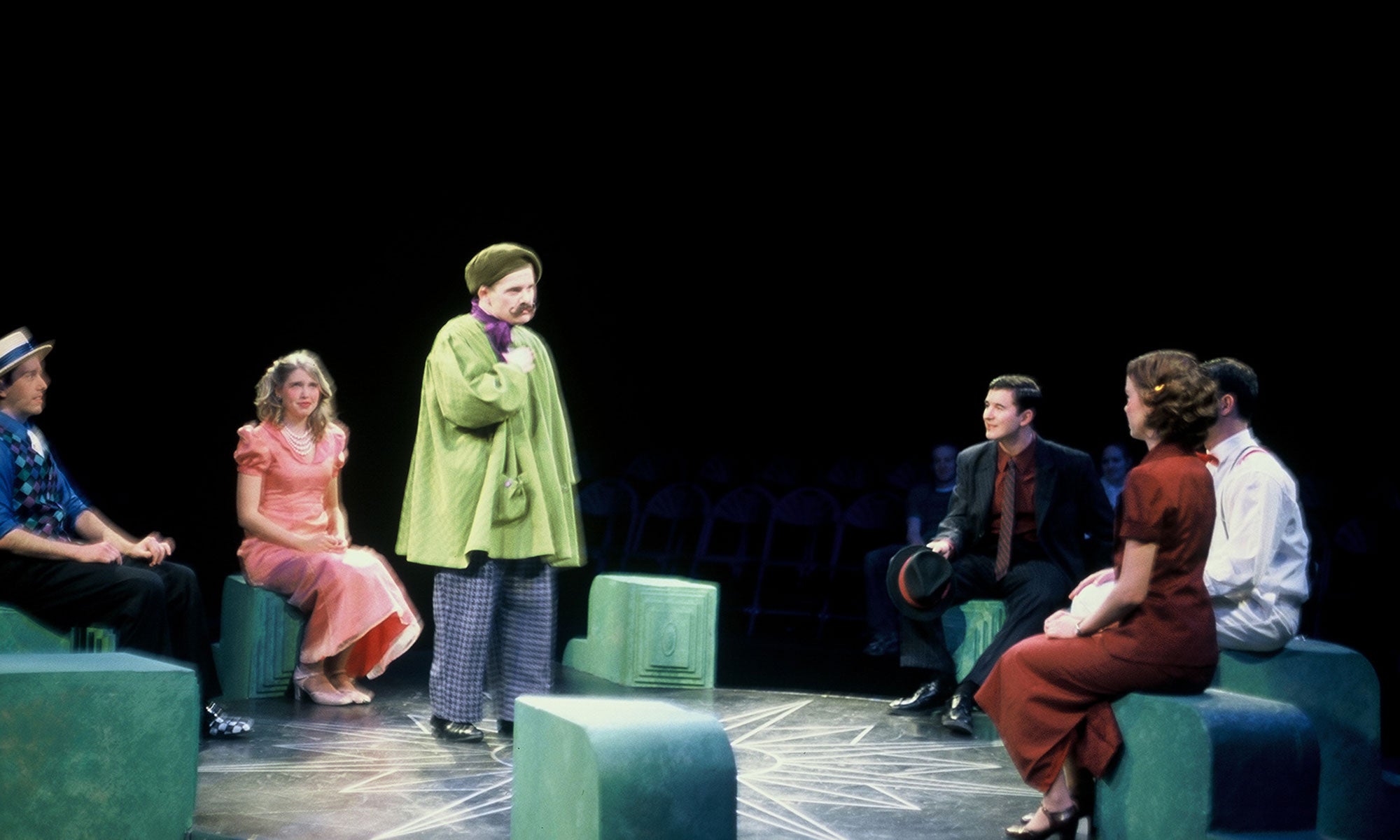 Mr. Appapolous, in his painting jacket, sternly addresses Ruth and Eileen about their lease. Frank, Bob, and Chick Clark watch with amusement.