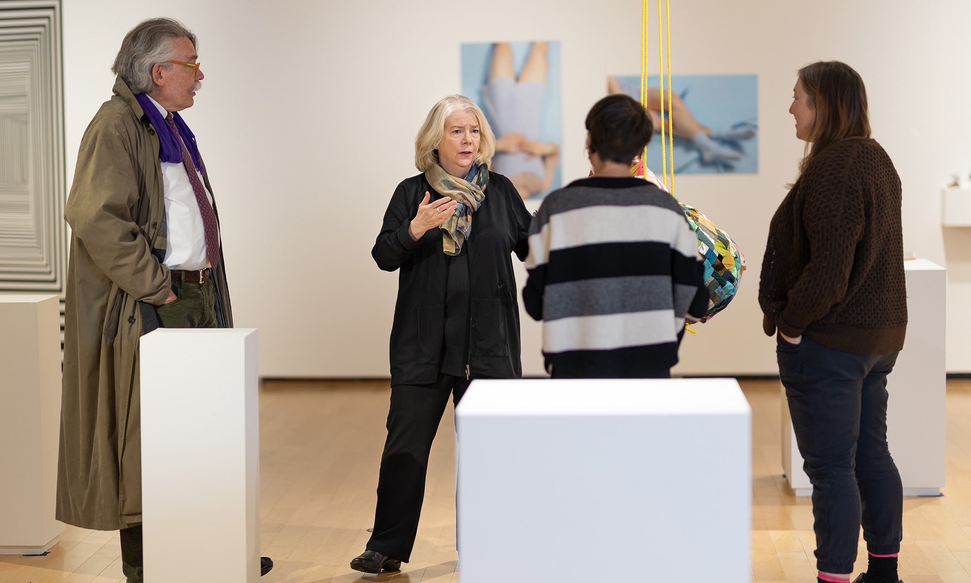 Nannette V. Maciejunes ’75 with people in gallery