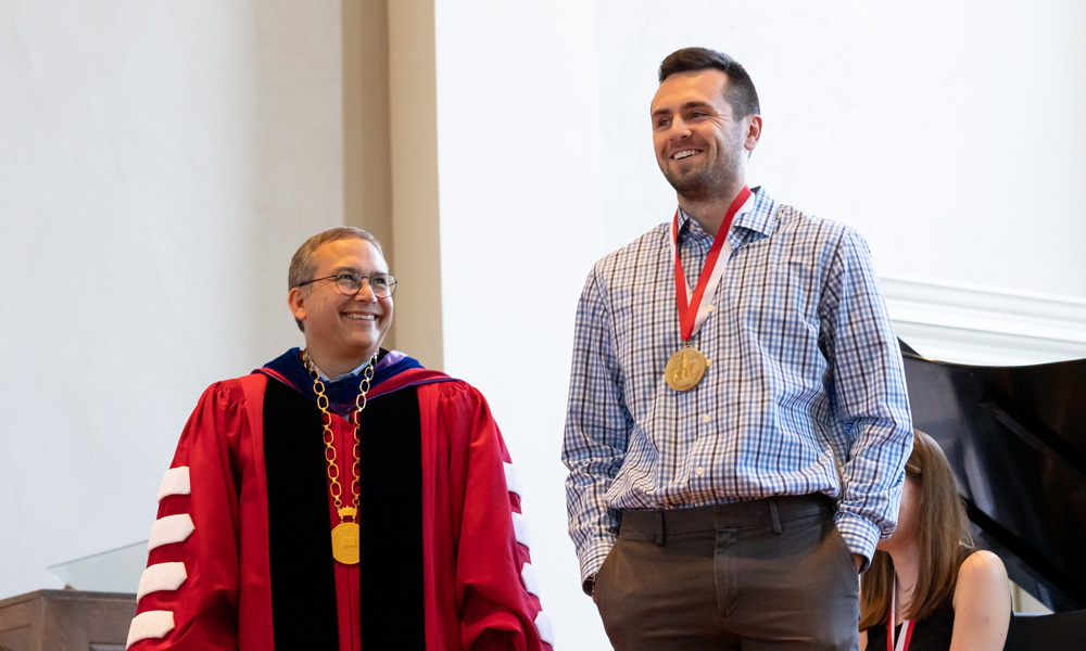 Liam Jeanette ’22 and President Adam Weinberg are all smiles on a day eight seniors receive President’s Medal awards.