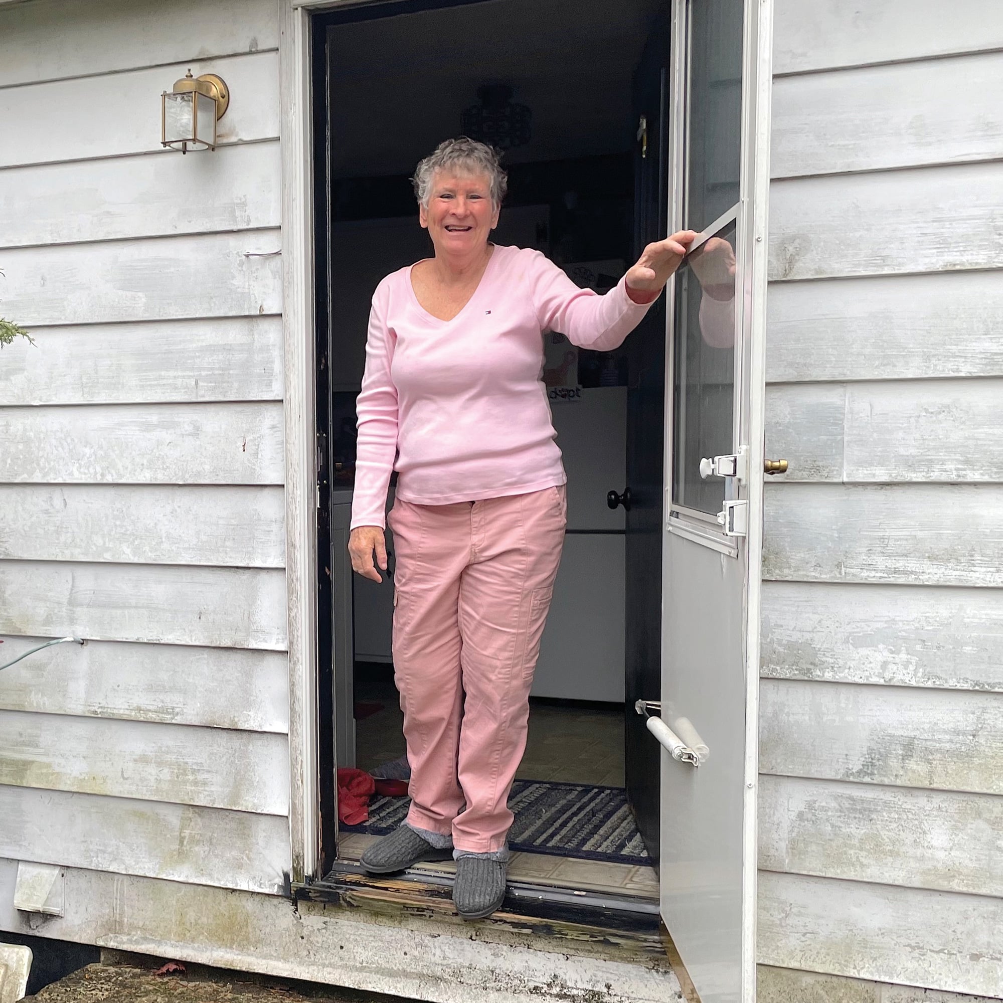 Barbara Vanhoose, 73, greets Denison journalists at her back door in rural Licking County.