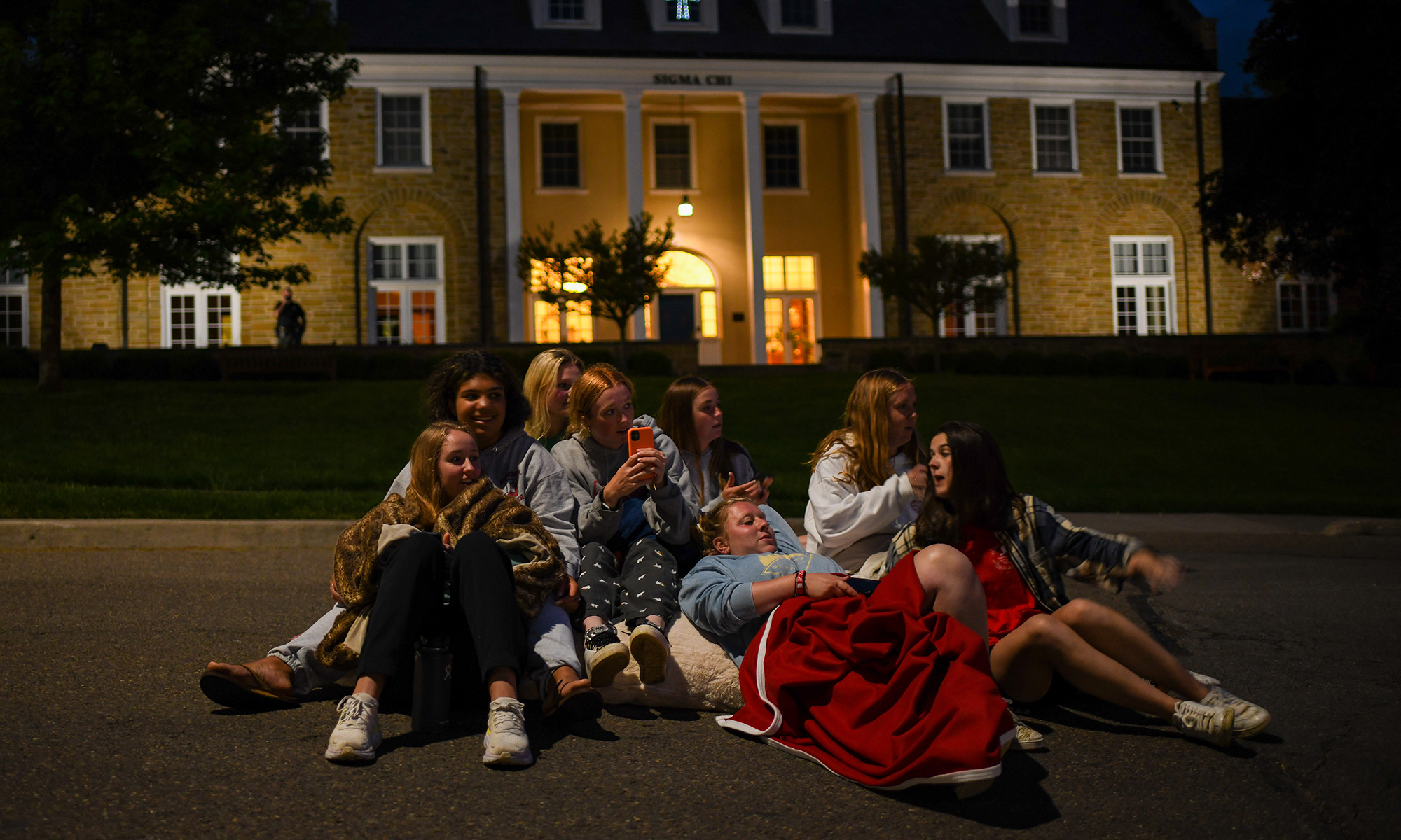 Students waiting for the sunrise outside Sigma Chi