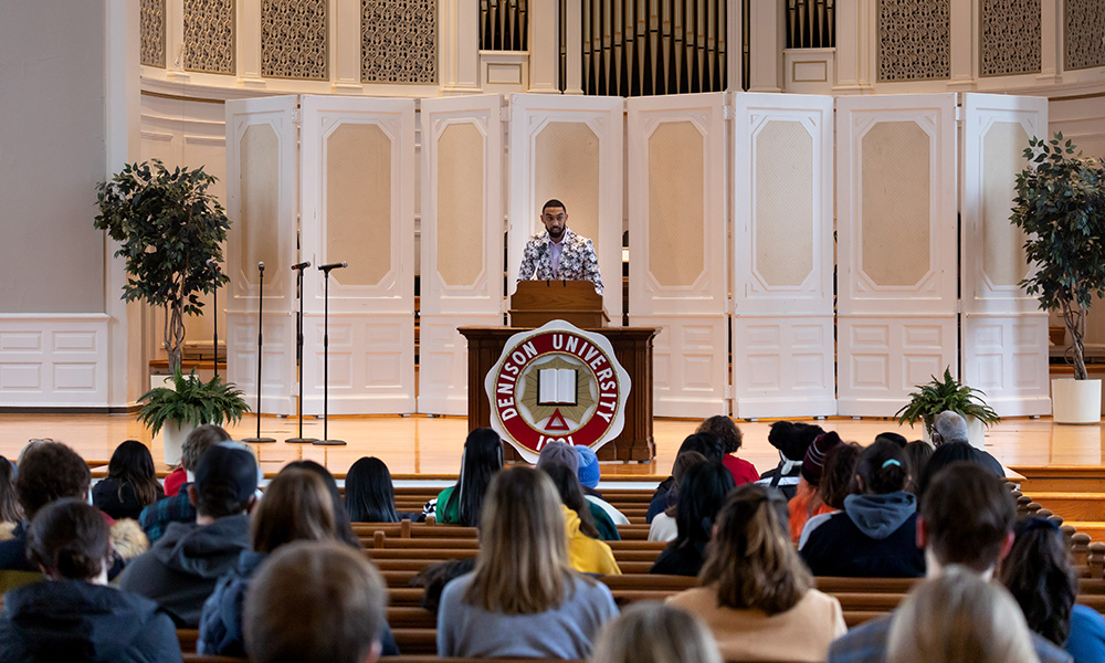 Dashn White ’22 welcomes the crowd at the Martin Luther King Jr. Celebration inside Swasey Chapel on Jan. 24, 2022. “As a fellow Denisonian,” White said, “I pose this question to you: ‘Where do we stand at times of challenge and controversy?’ This question is why we are here today.”