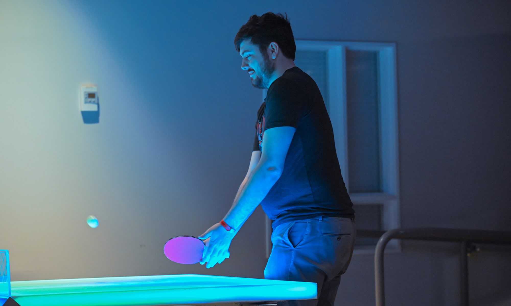 Student playing ping pong