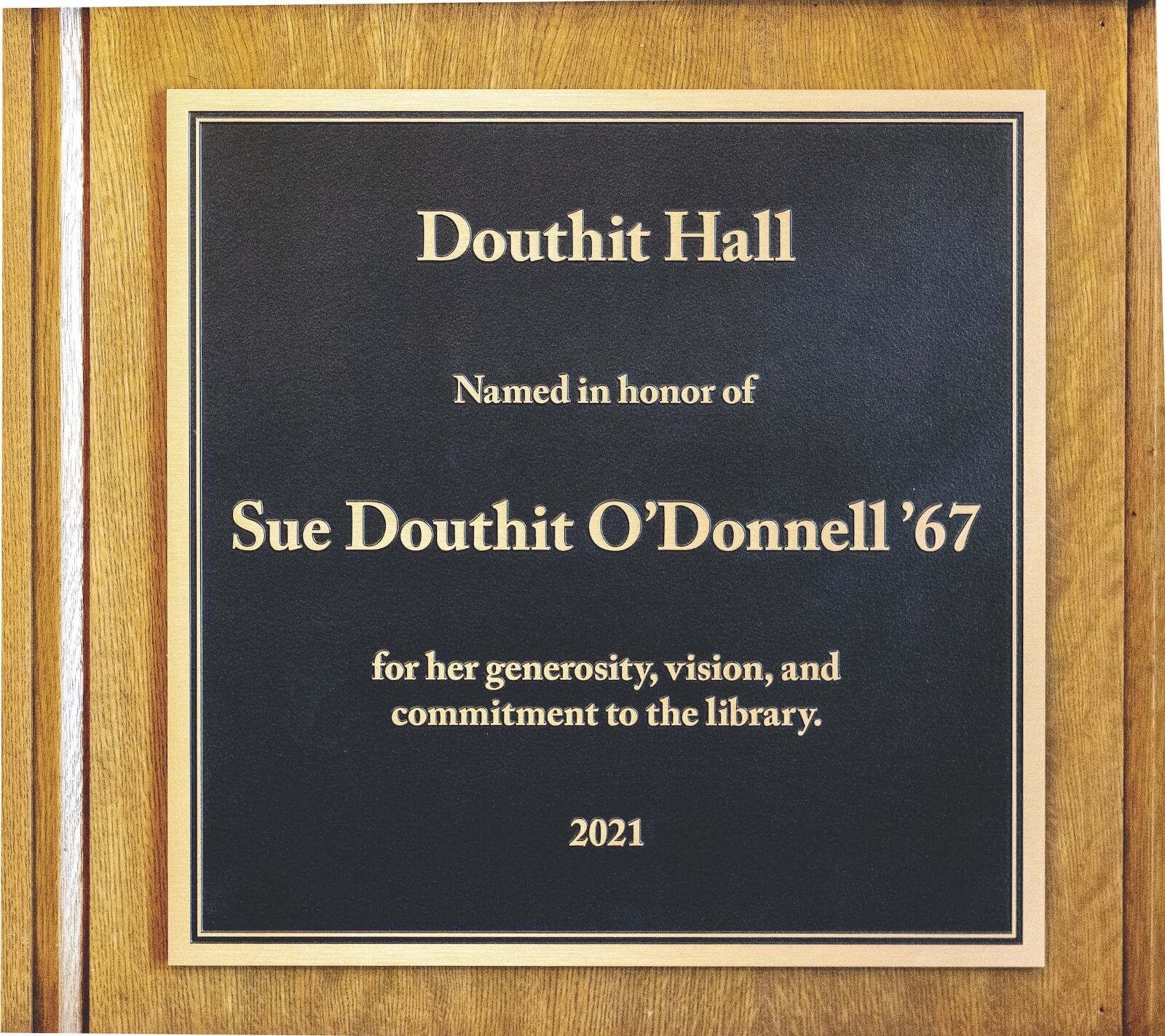 A plaque naming the original library building Douthit Hall has been placed just inside the main entrance.