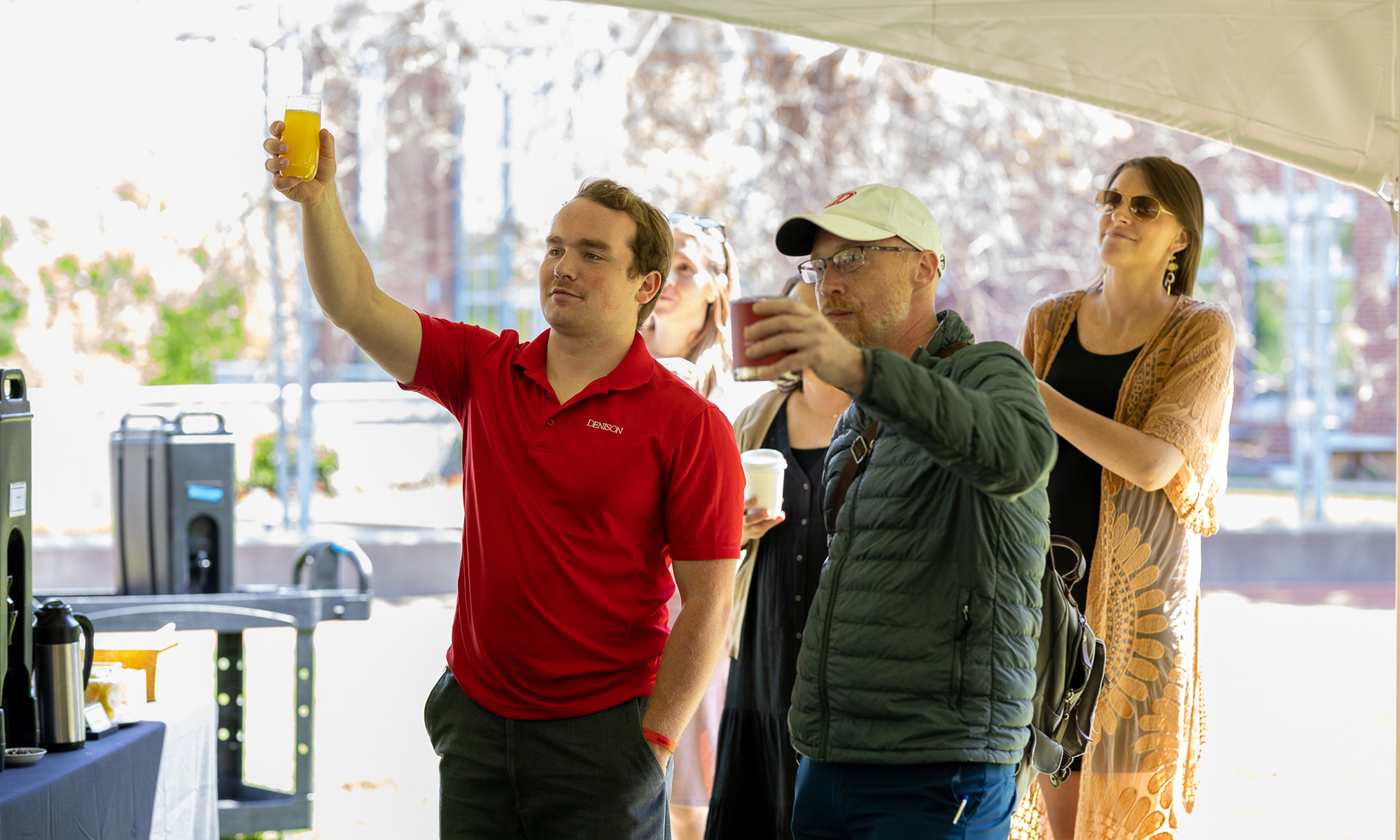 Mac Hammett (left) toasts alongside senior class dean Michael C. Brady