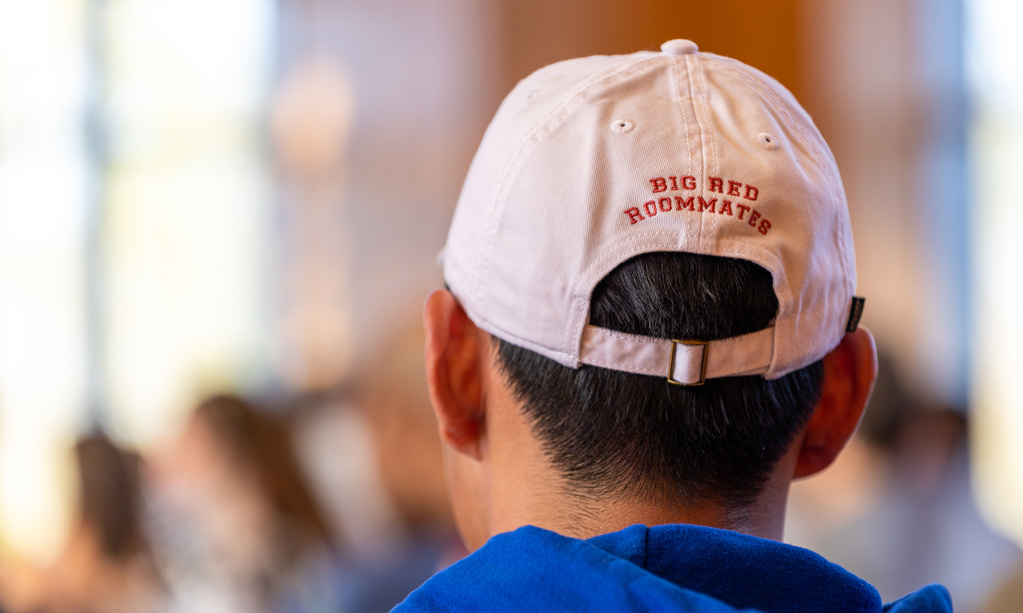 Denison ball cap with 'Big Red Roommate' embroidered on the back