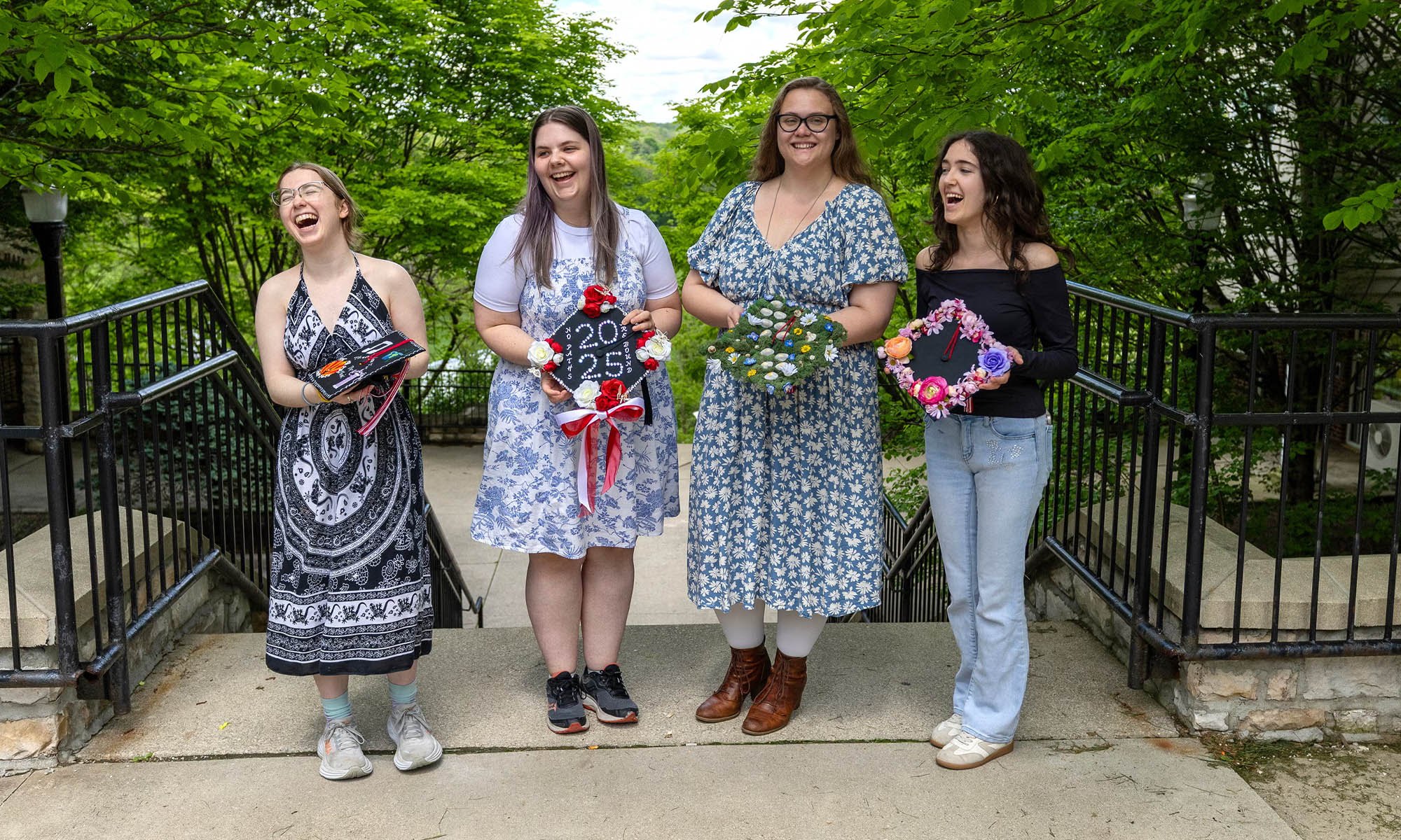 Students display their mortarboards.