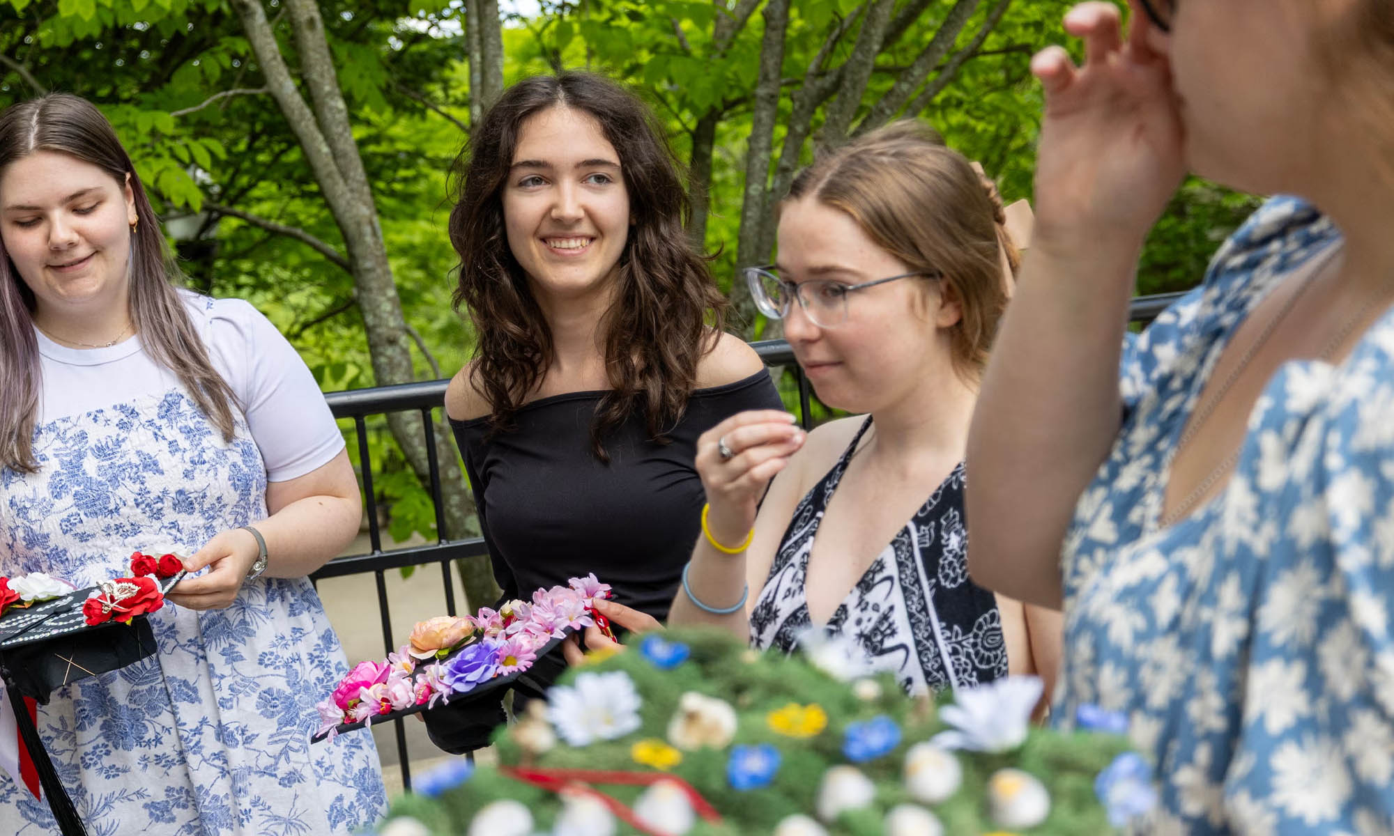 Students display their mortarboards.