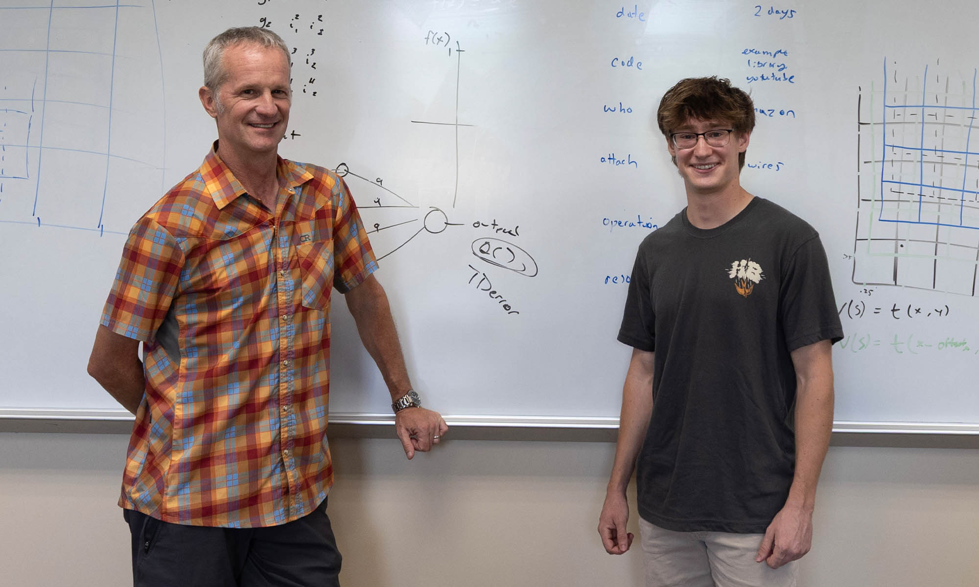 Photo of computer science Professor Matt Kretchmar and student Joe Teates ’28.