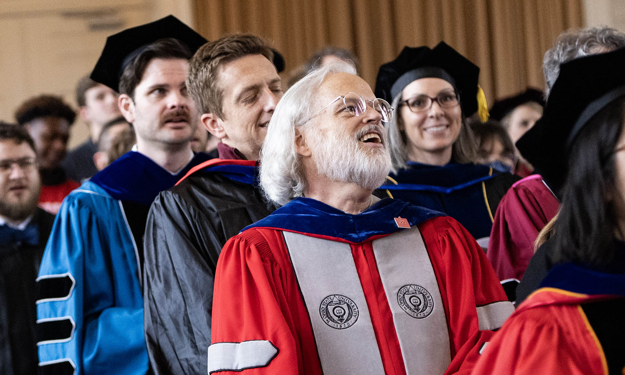 Faculty in their academic regalia in Swasey Chapel.