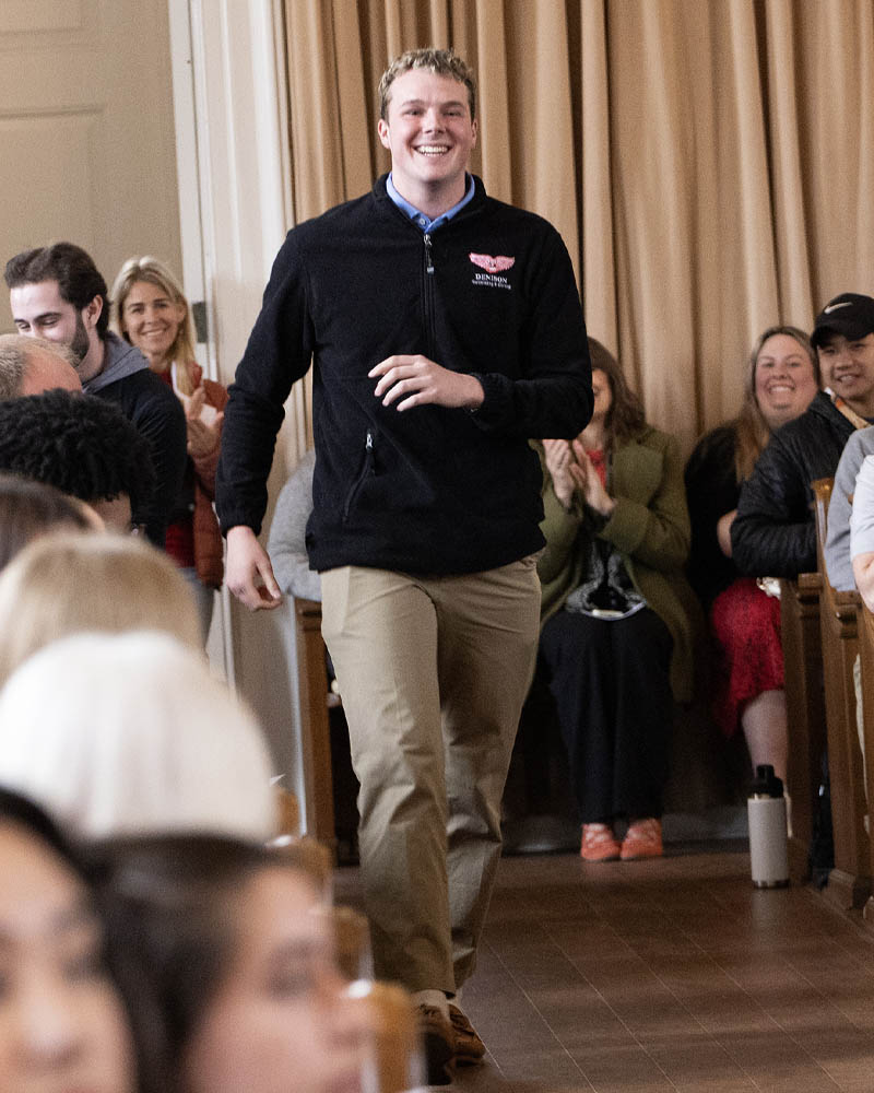A student walks up to the stage.