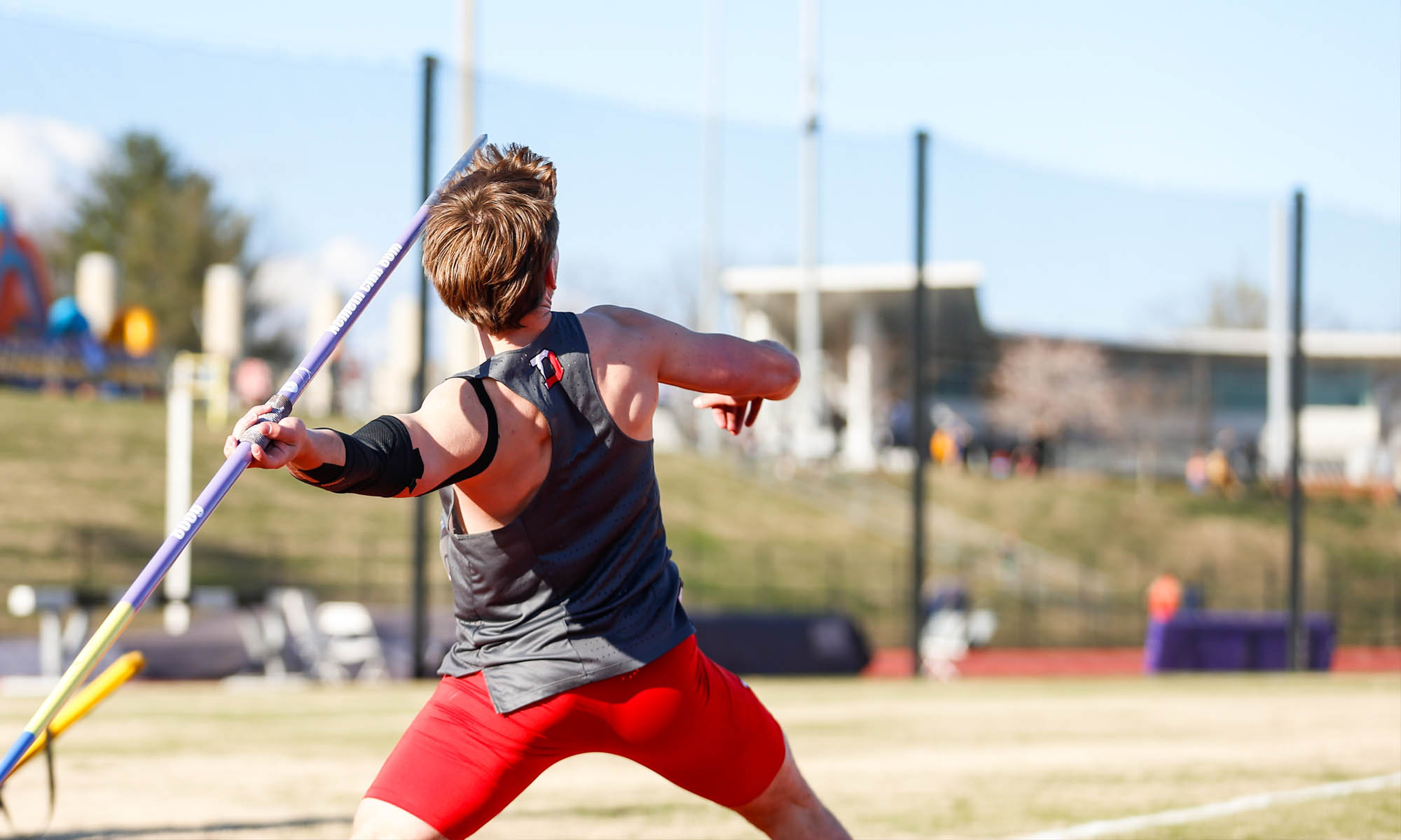 Another angle of Andrew D’Asaro throwing a javelin, this one showing his adjusted stance to compensate for a torn ligament.