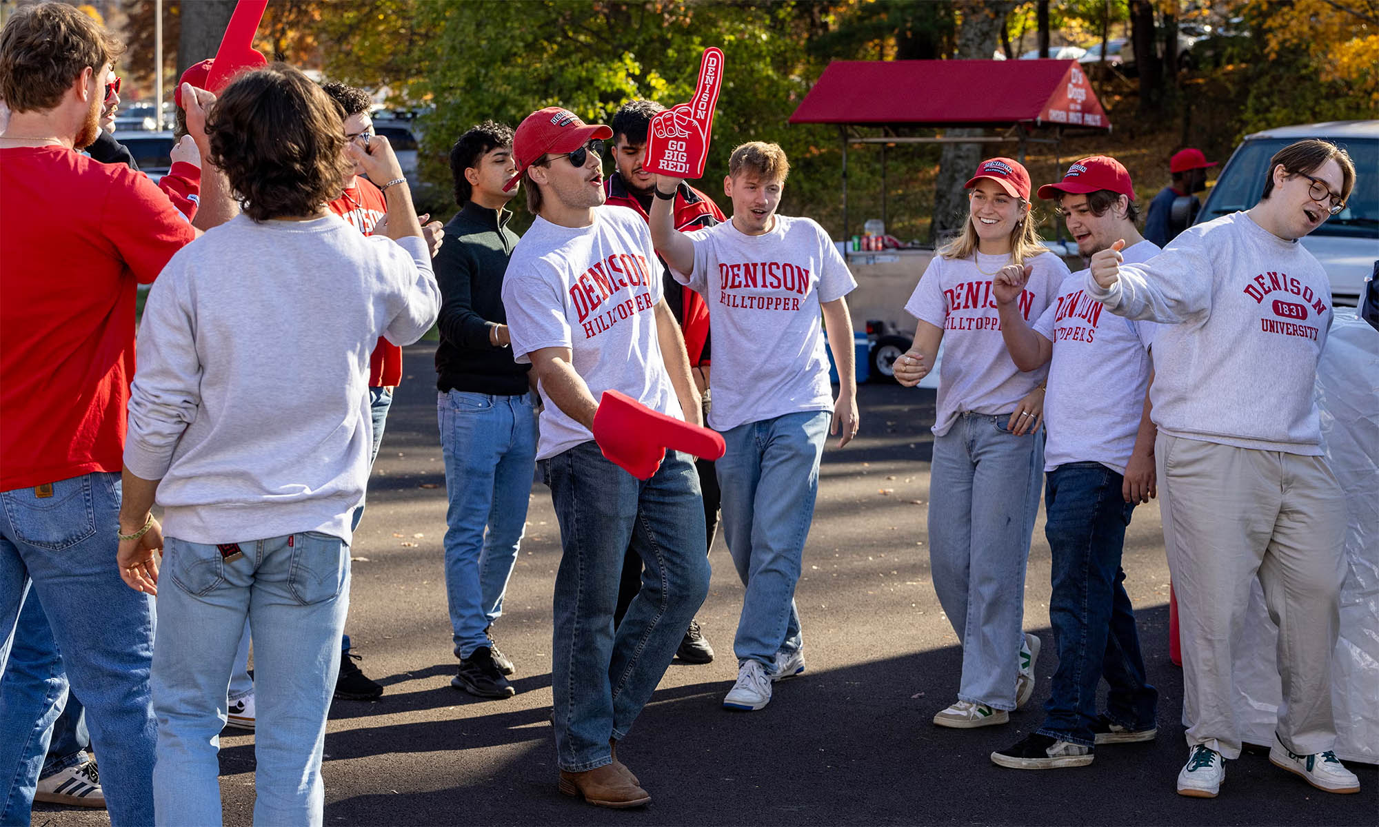 A group of Denison alumni gathered and celebrating before a football game.