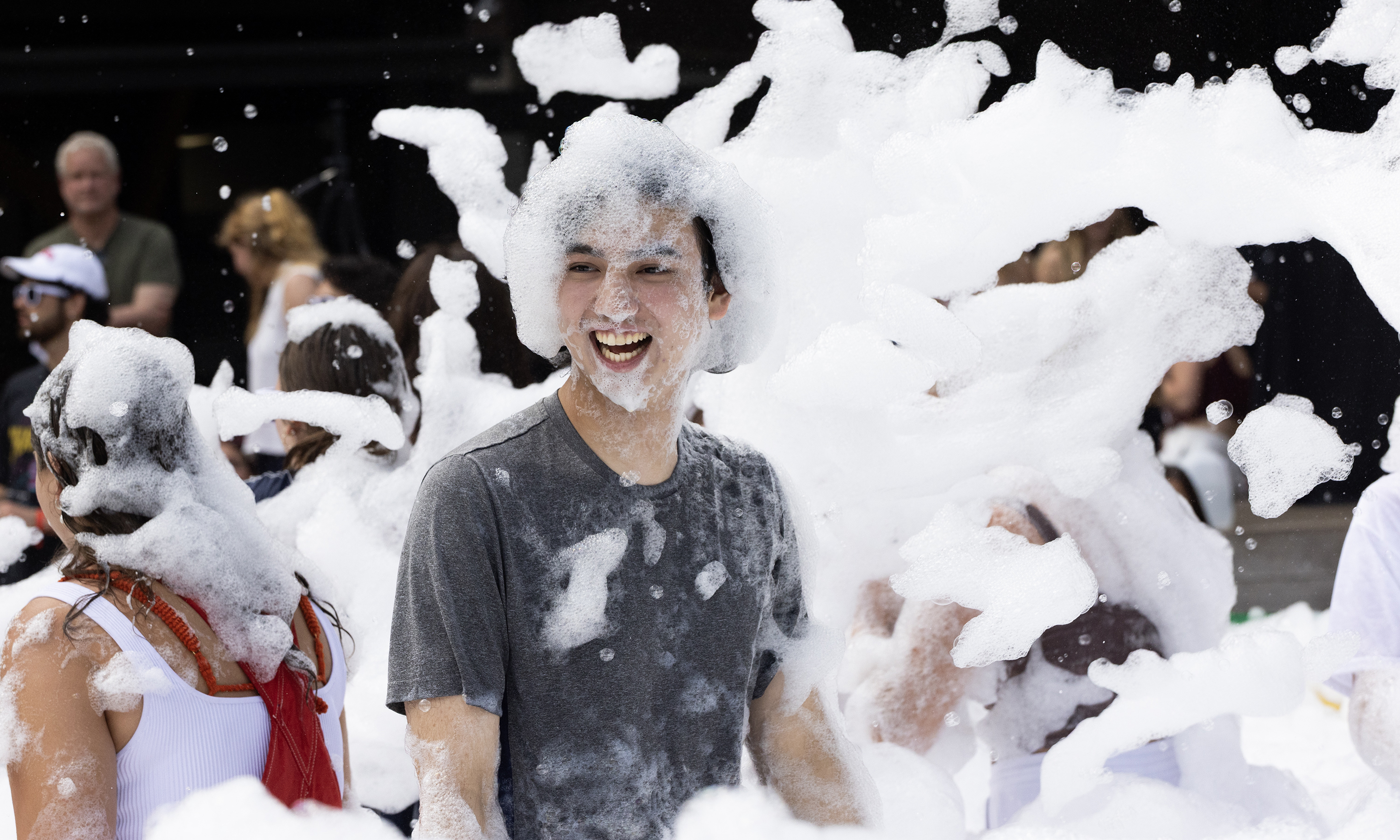 Denisonians playing in a soap foam pit.