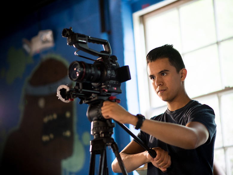 Cinema student sets up the camera