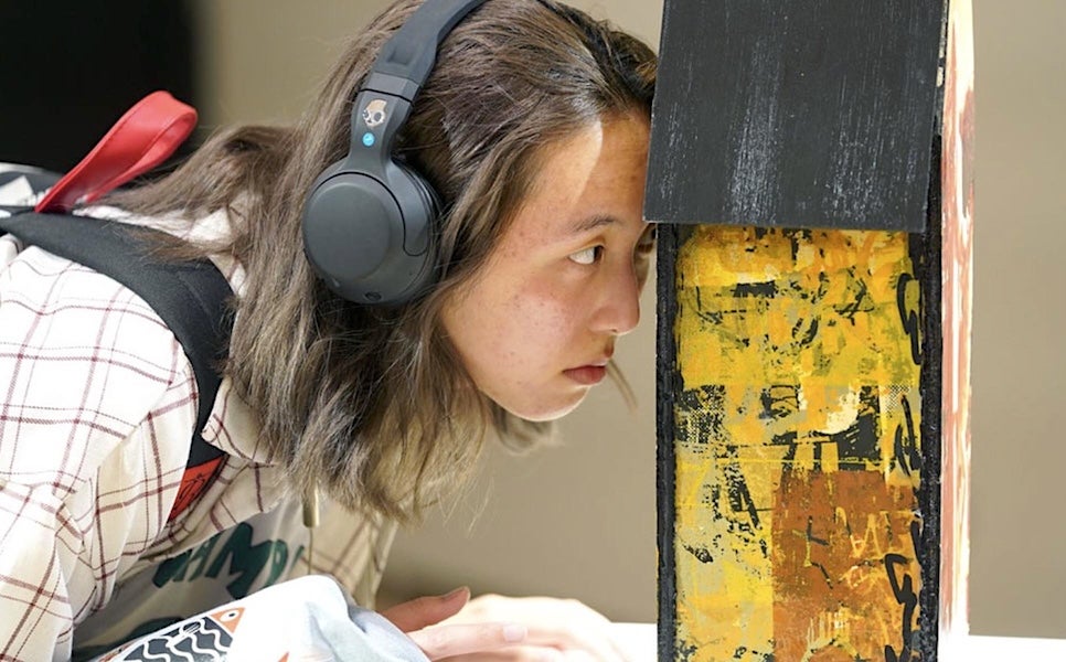 Museum visitor explores the exhibition