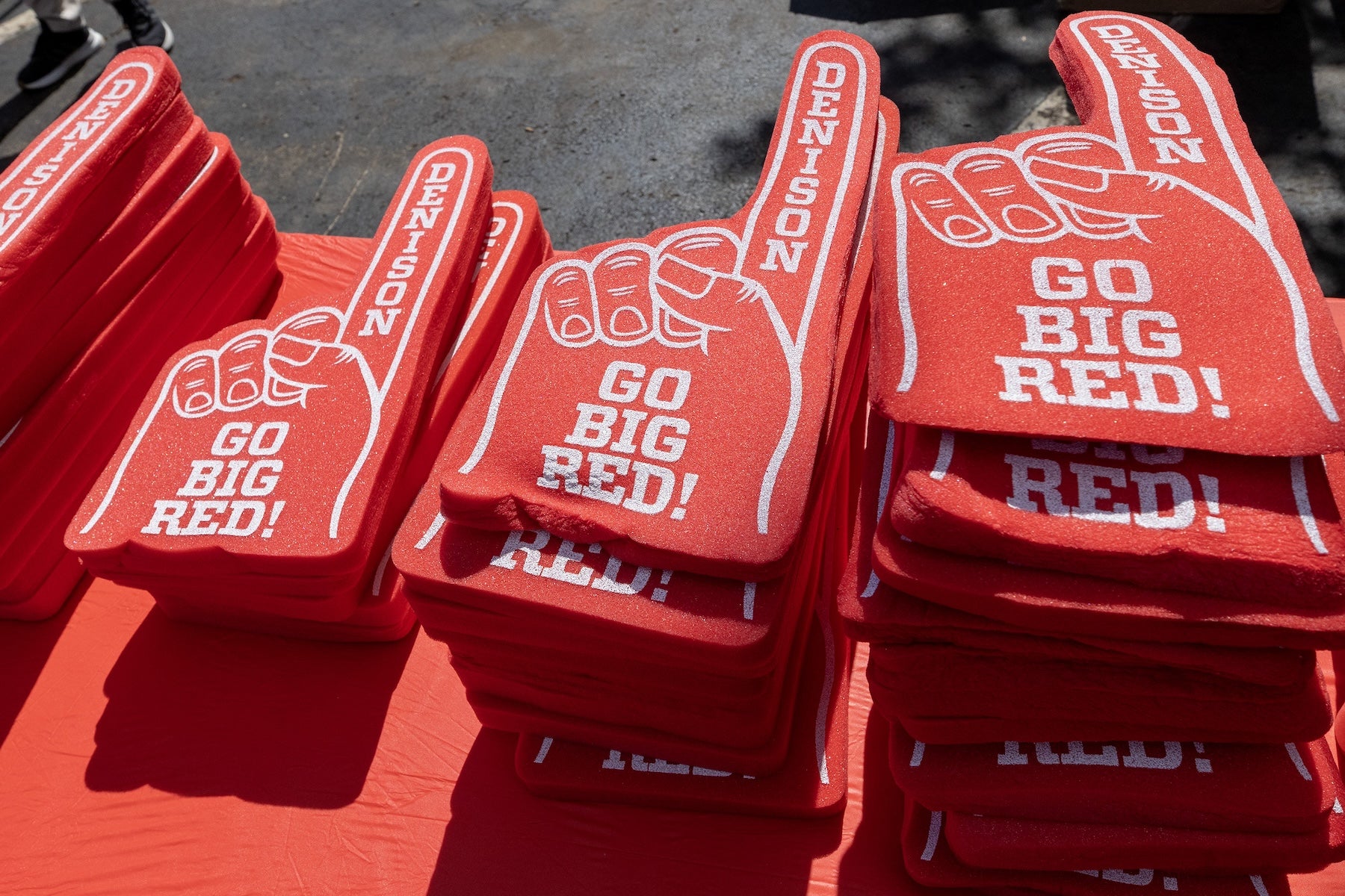 Go Big Red! foam fingers stacked on a table