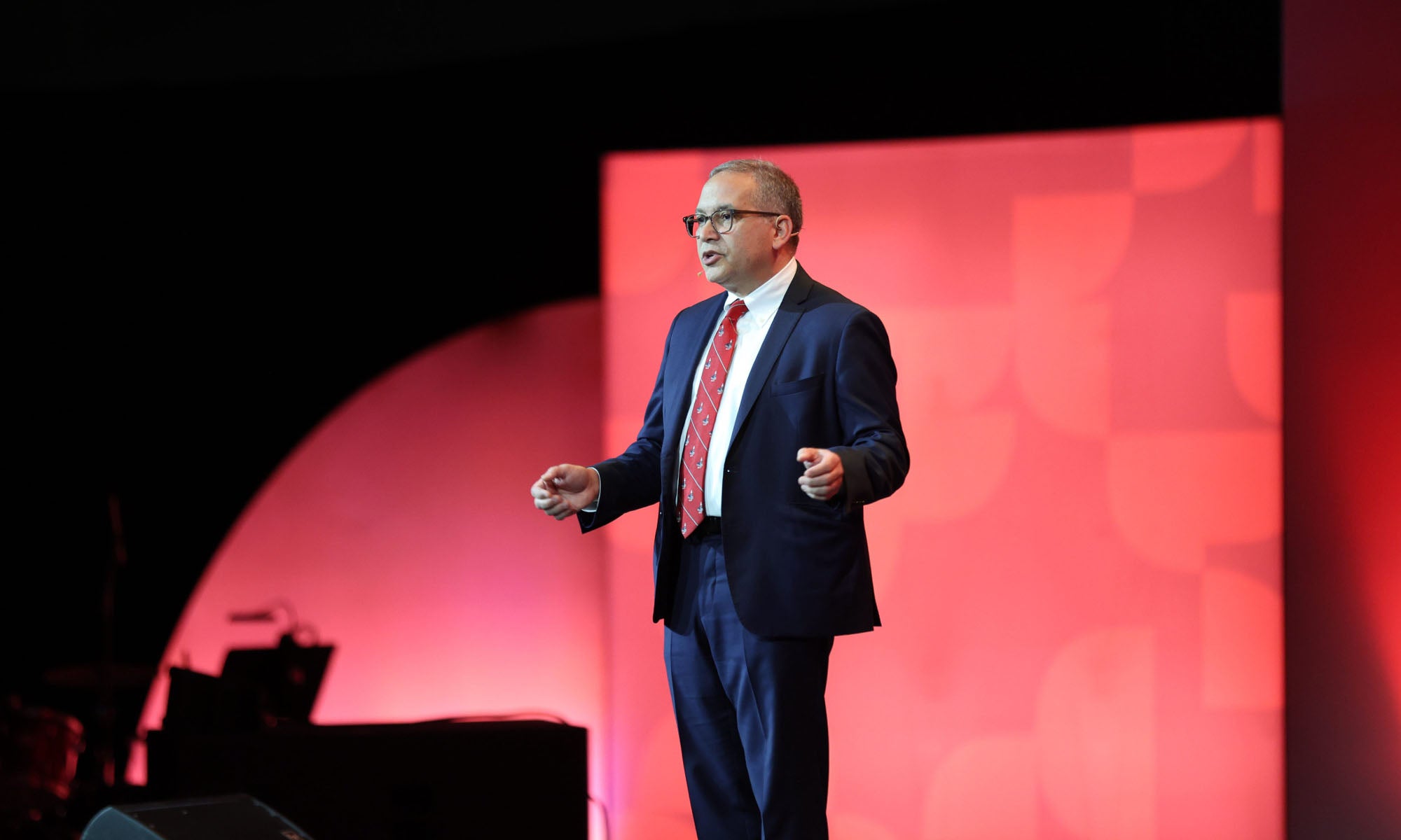 Photo of President Adam Weinberg on a stage at the gala.