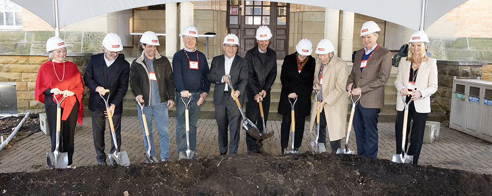 Denison University leadership and donors holding shovels and wearing construction hats at the data center groundbreaking.