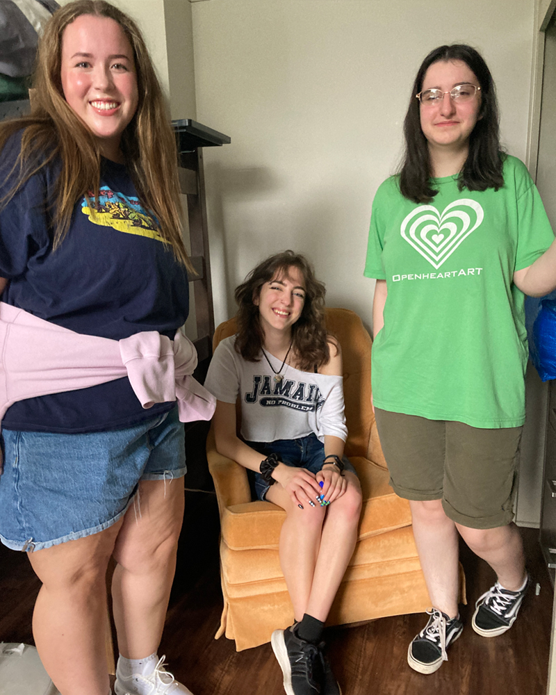 Three Denison roommates pose for a photo in their new room.