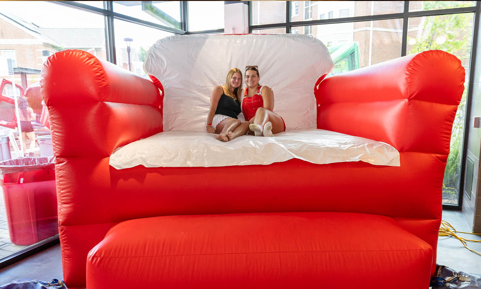 Students sit on an inflatable chair.