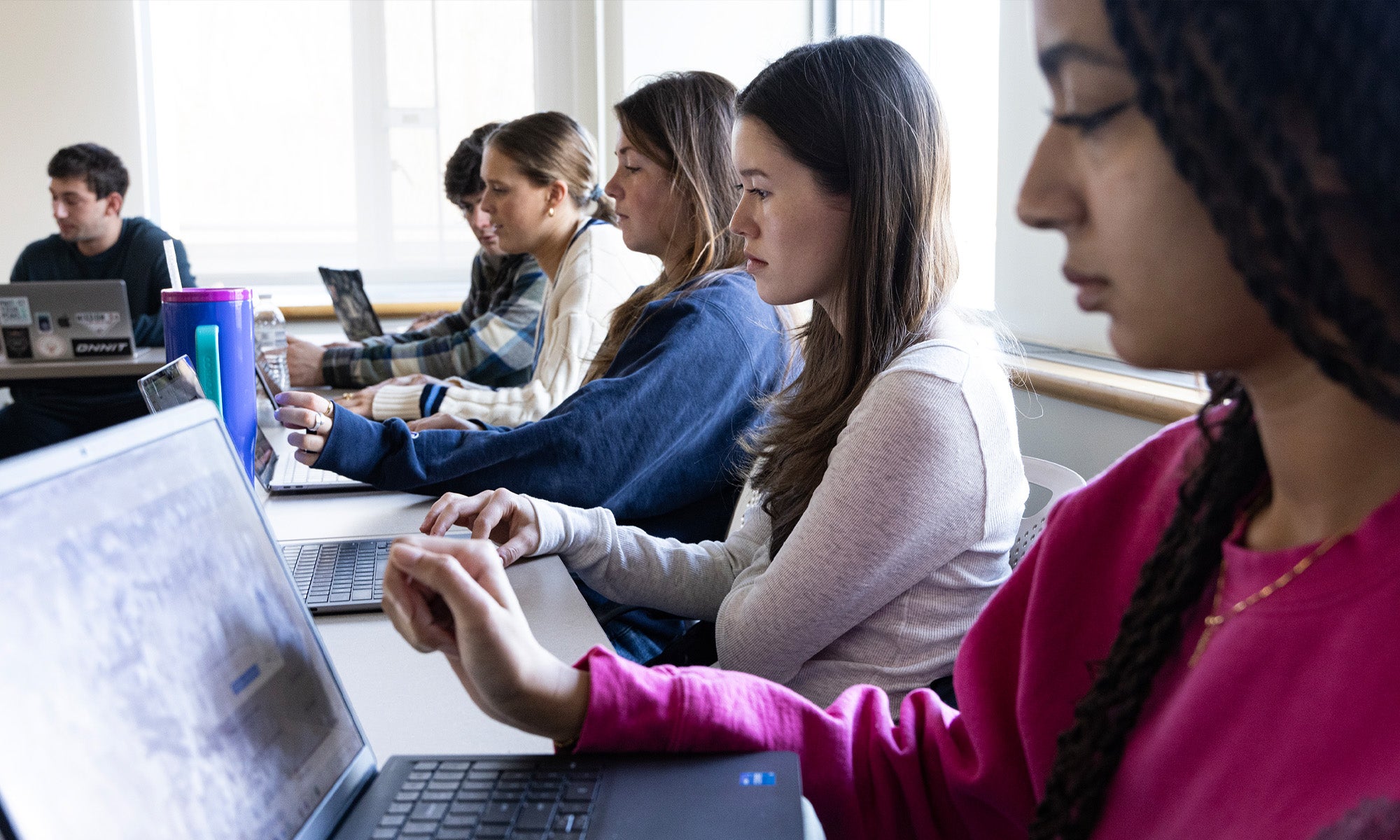 Students working on laptops.