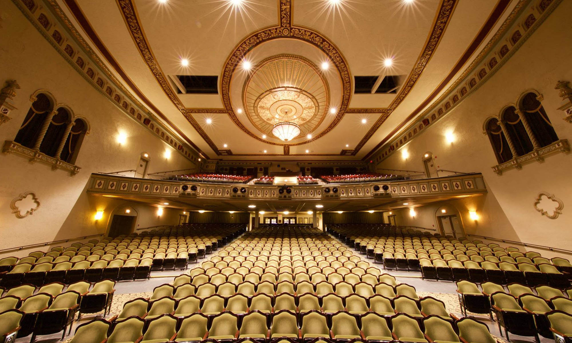 A 1920s theatre with a balcony and chandelier. 