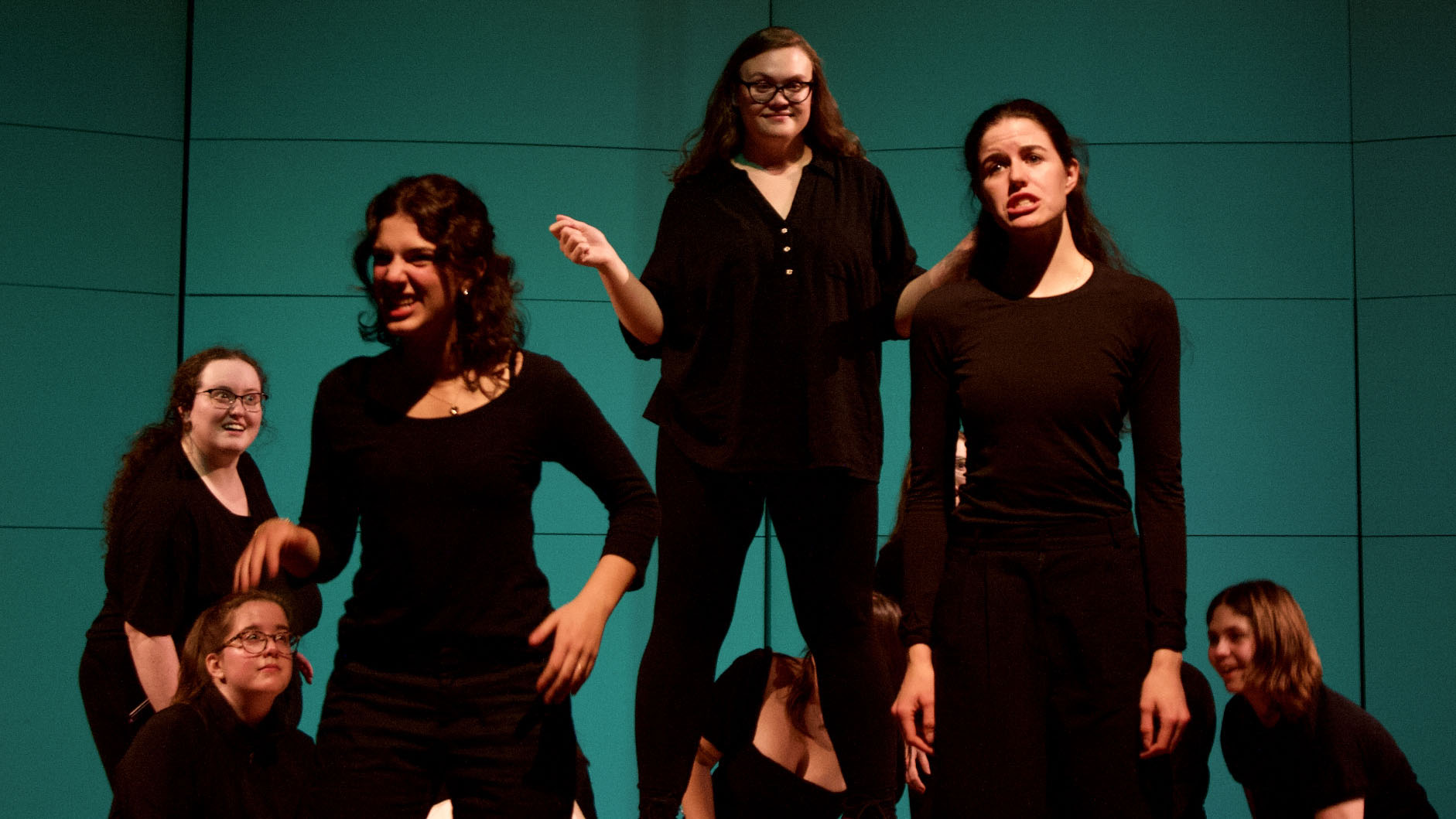 Students perform on stage.