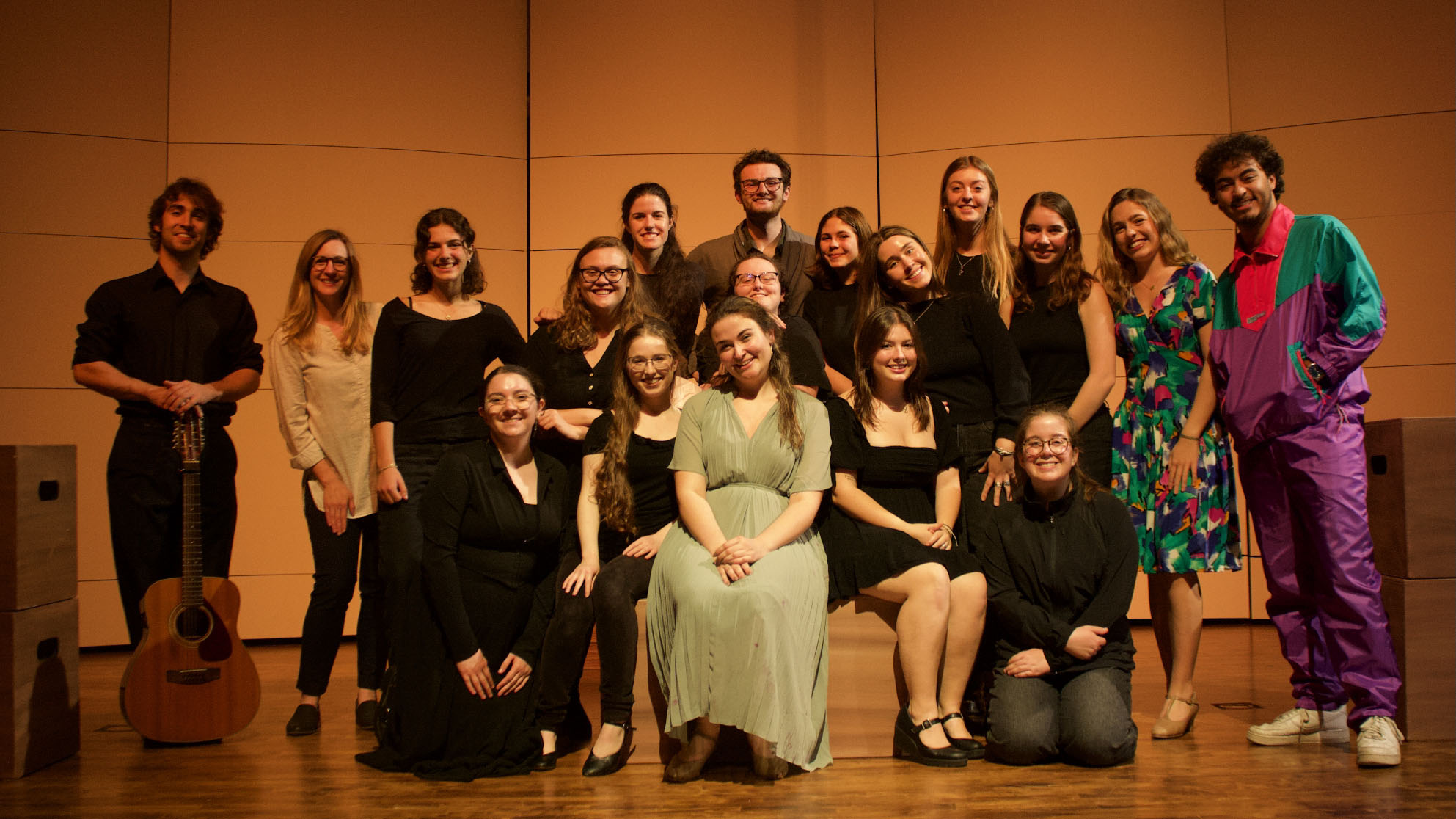 Students perform on stage.