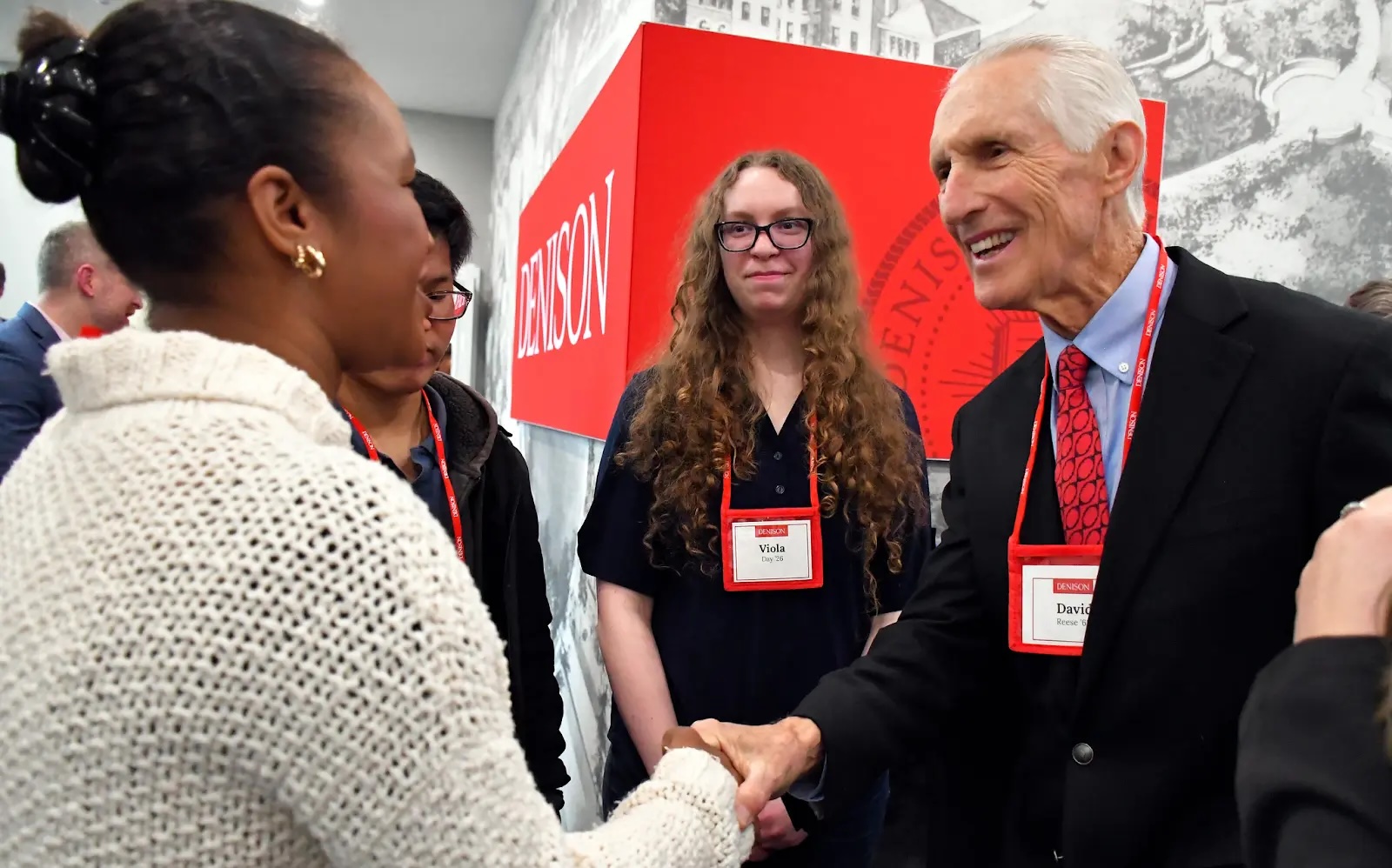 David Reese shake hands at the Reese House ribbon-cutting ceremy