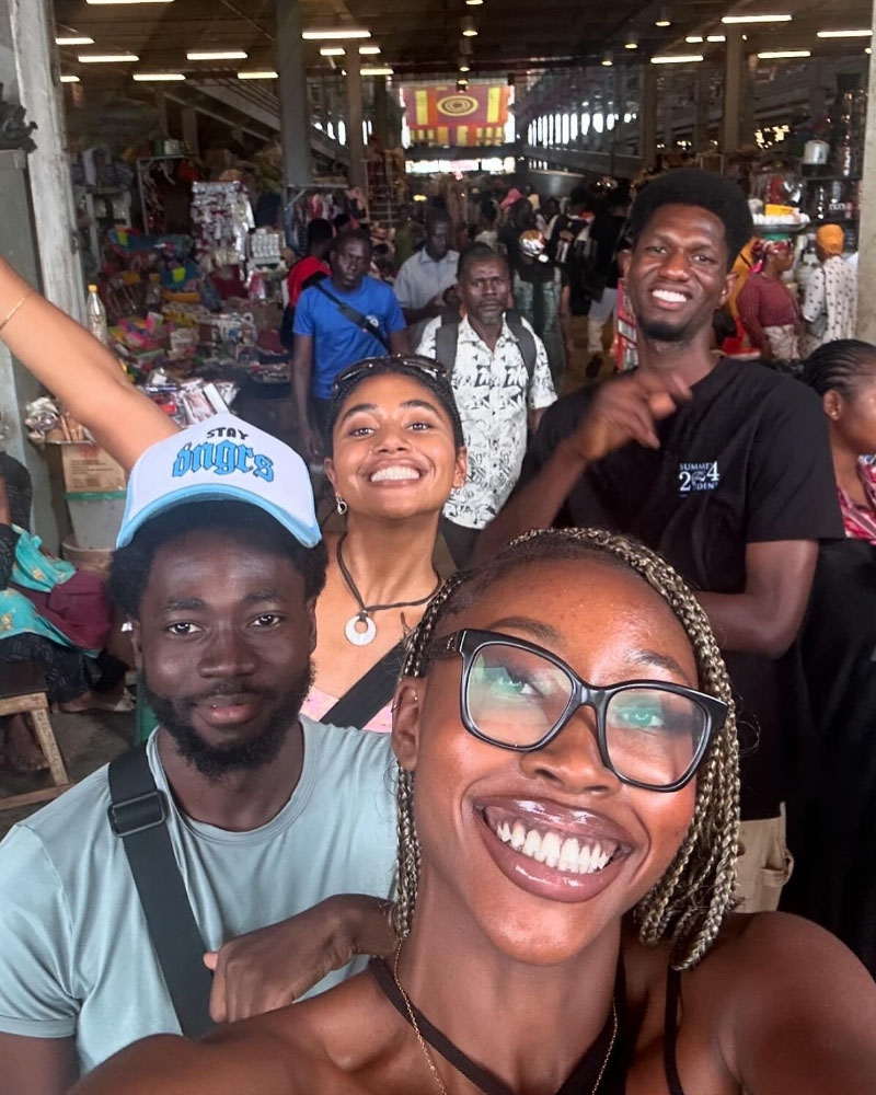 A selfie photo of Ashlee Salmon '26 with friends in Ghana.