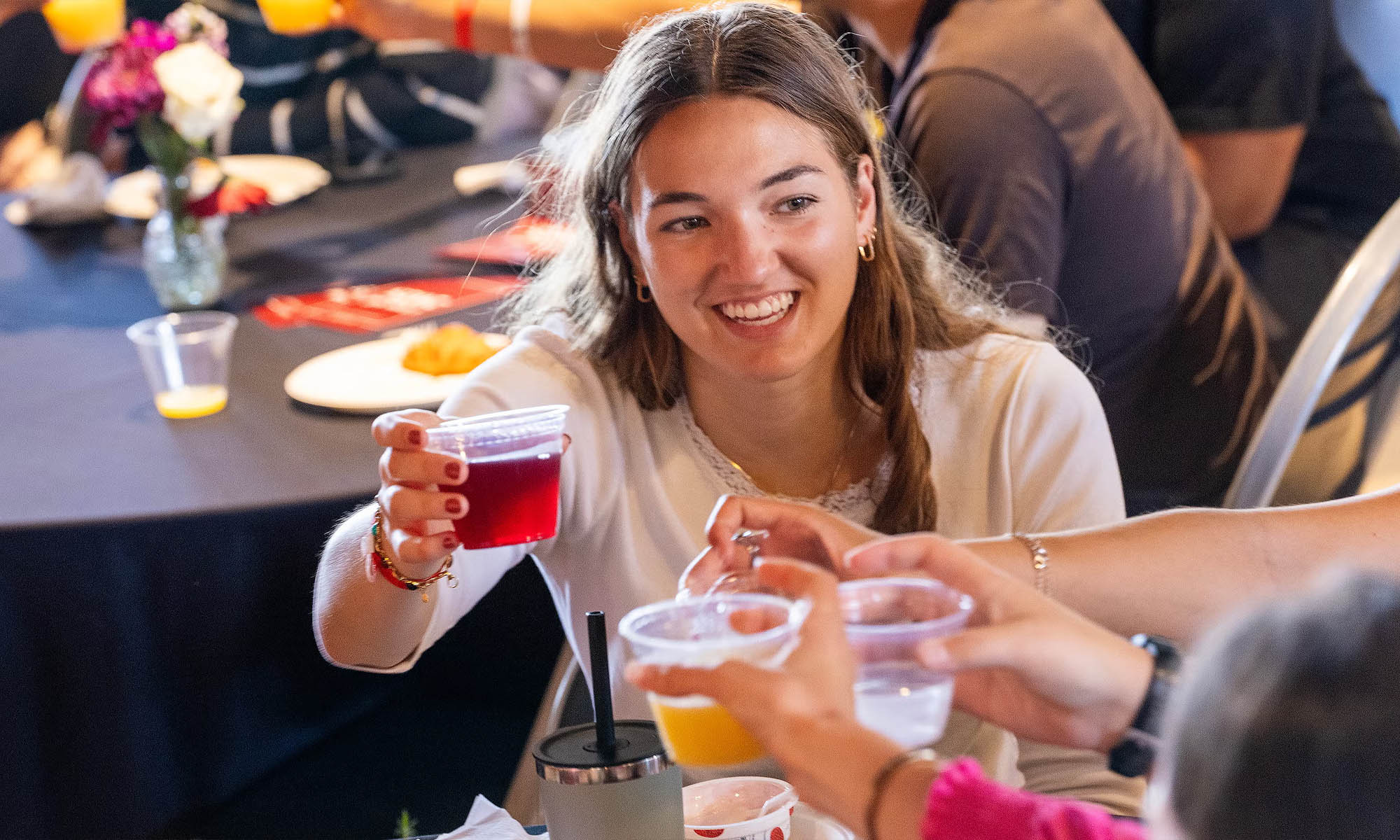 Students share a toast.