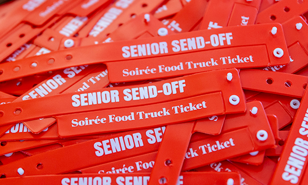A pile of senior send-off wristbands
