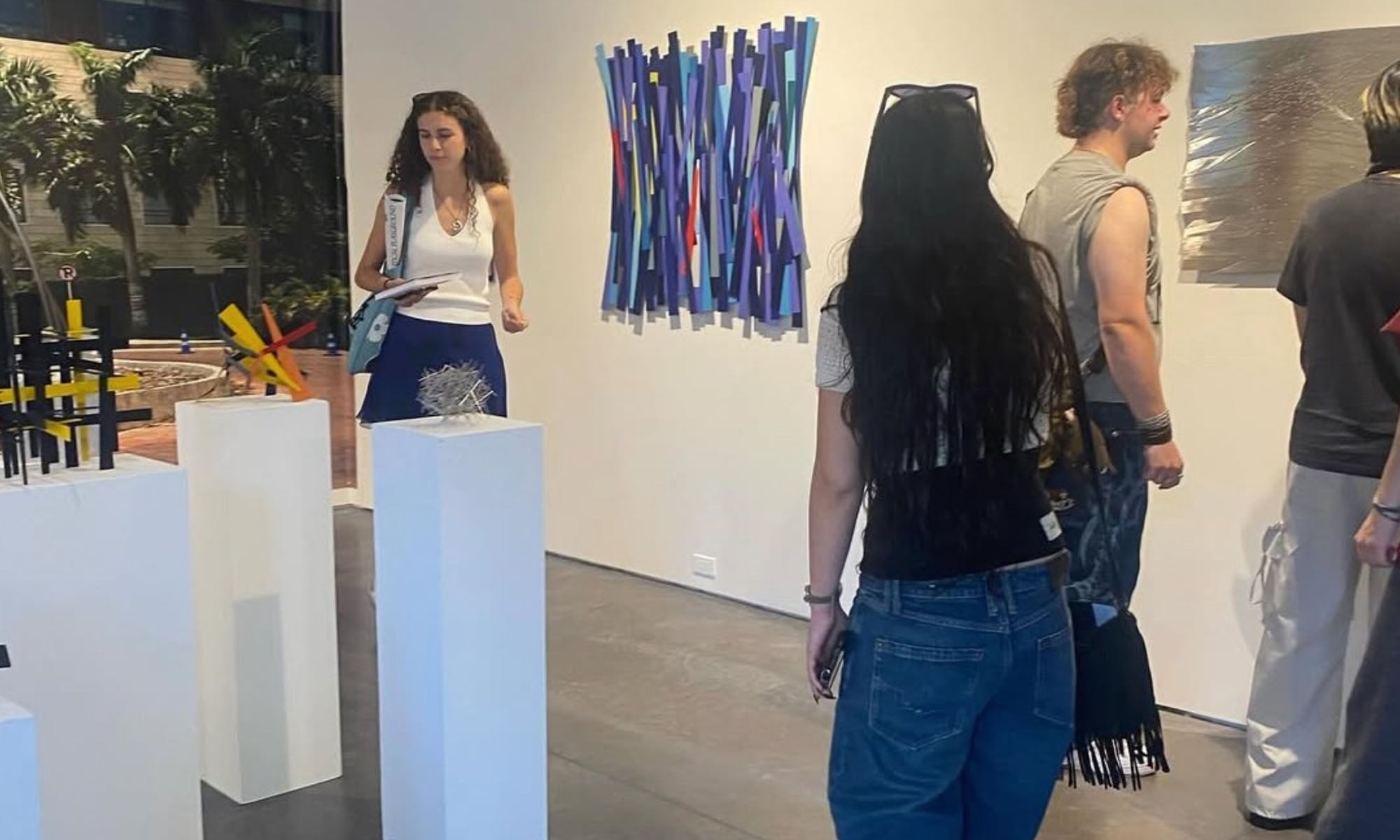 Students are touring an art gallery.