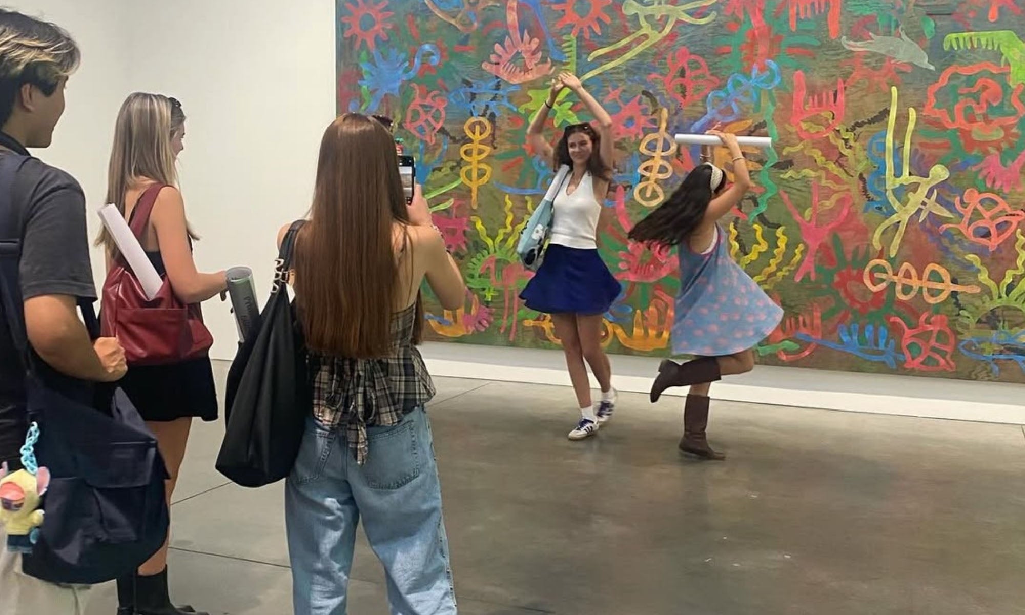University students touring an art gallery.