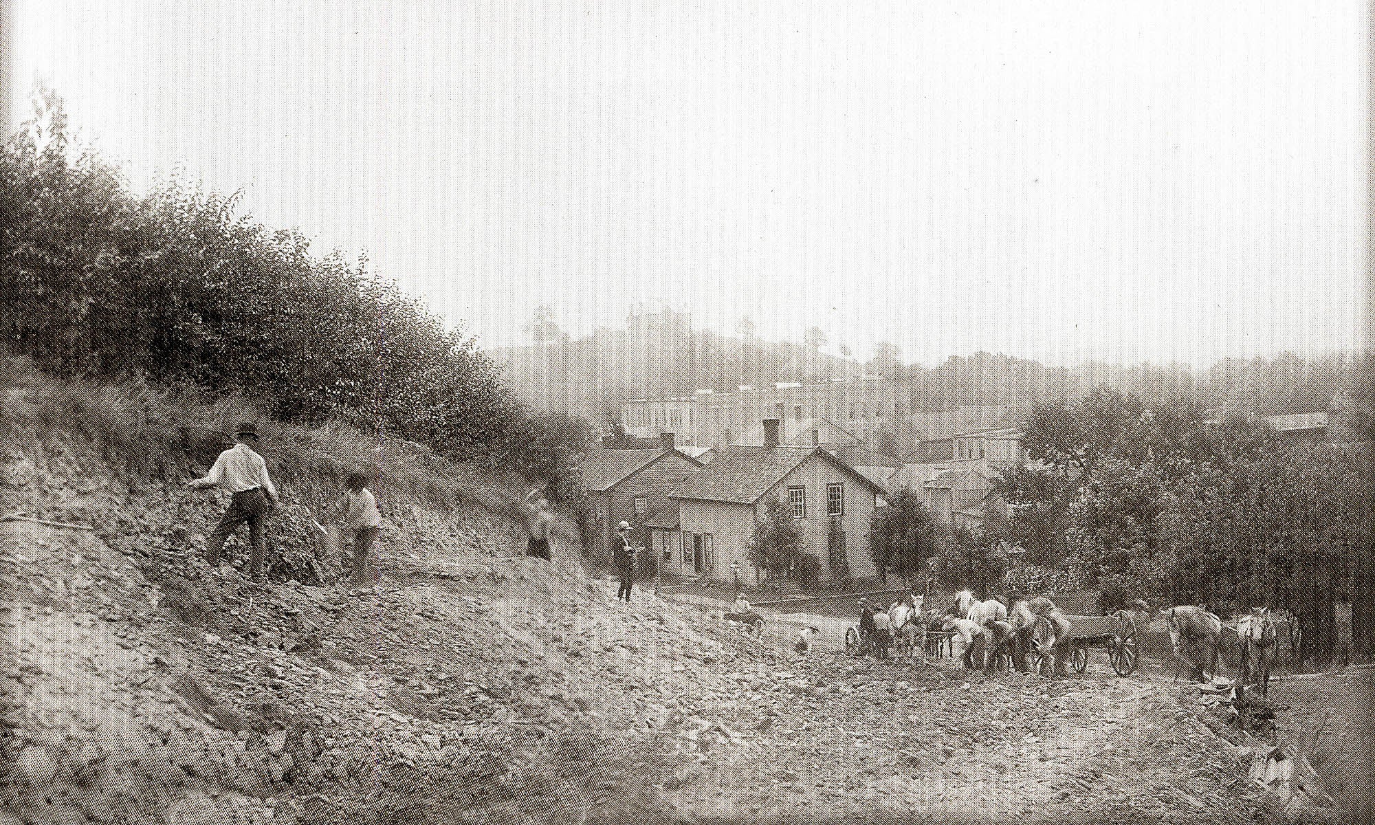 Black and white photo, circa 1800s, showing construction of the road on The Hill overlooking Granville.