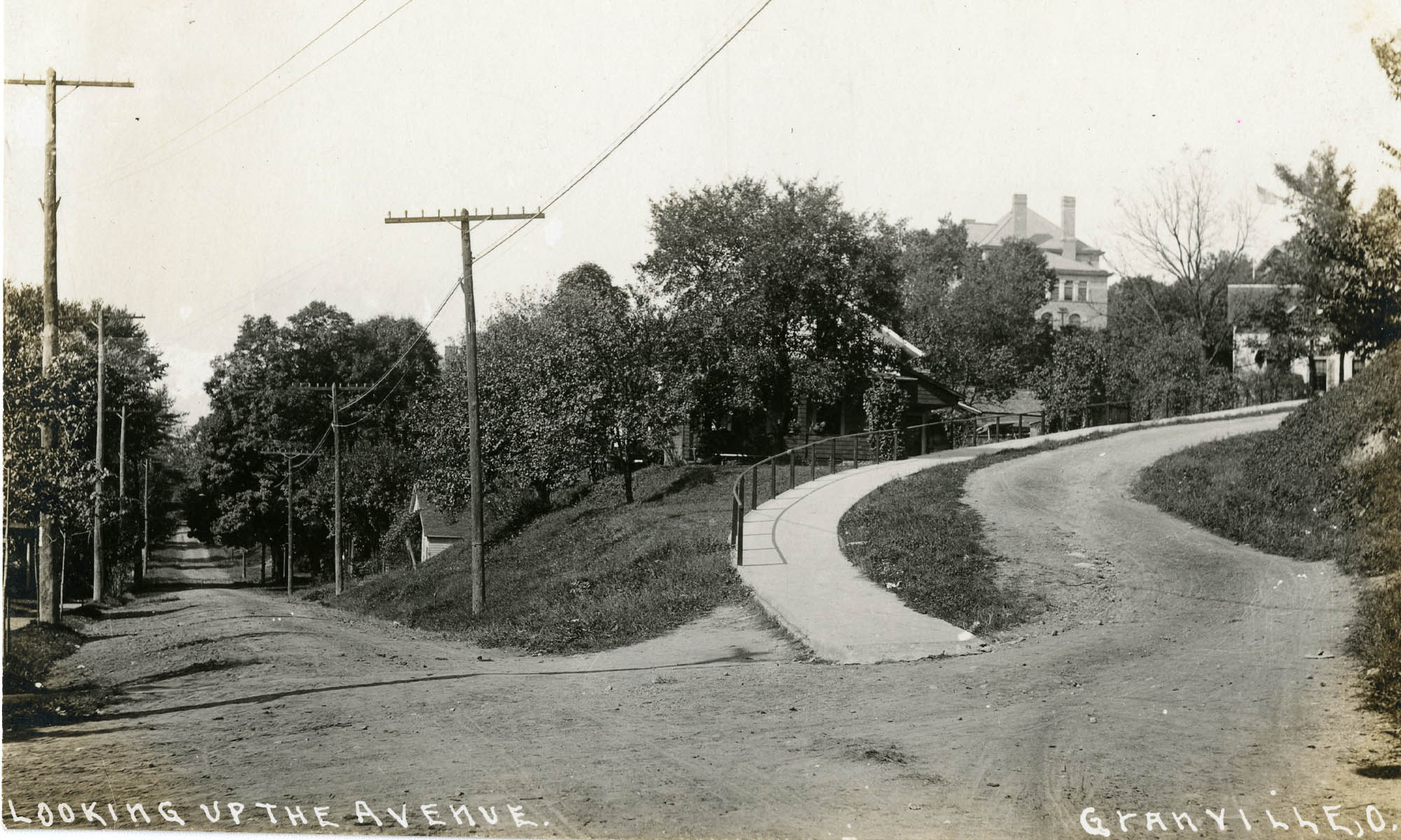Black and white photo circa 1900s looking up from College Avenue.