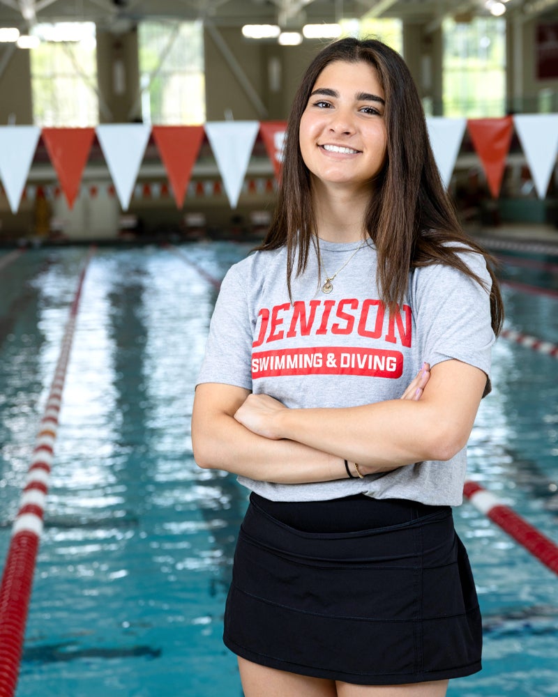 Audrey Brink standing in front of a pool