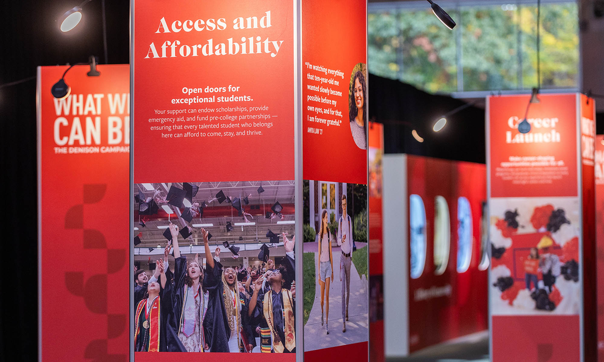 A large walk-thru display of images and text about Denison set up for visitors at a fall event.