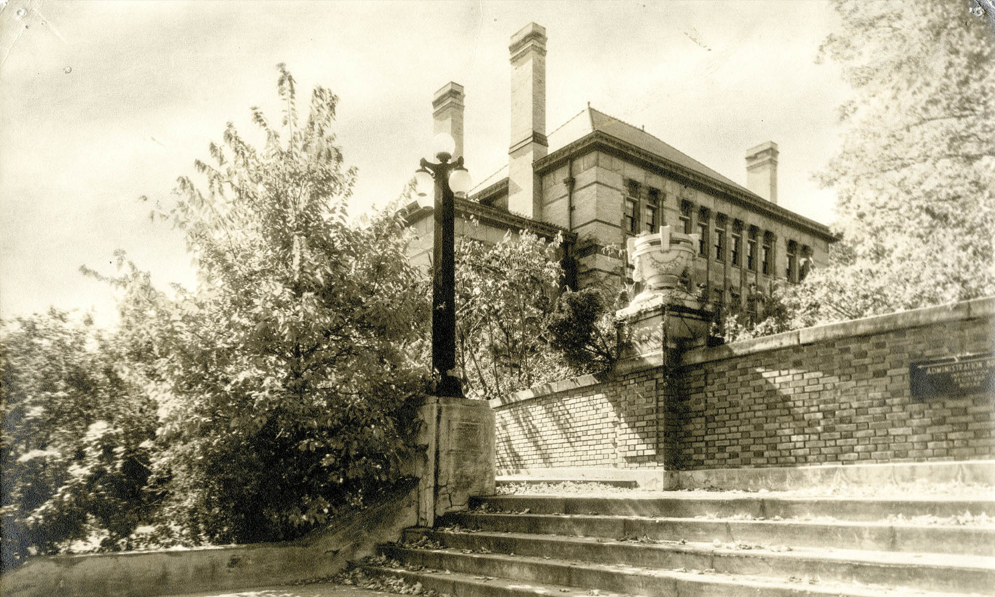 Sepia-toned photo of "Avenue Gate" looking up toward Doane Hall.