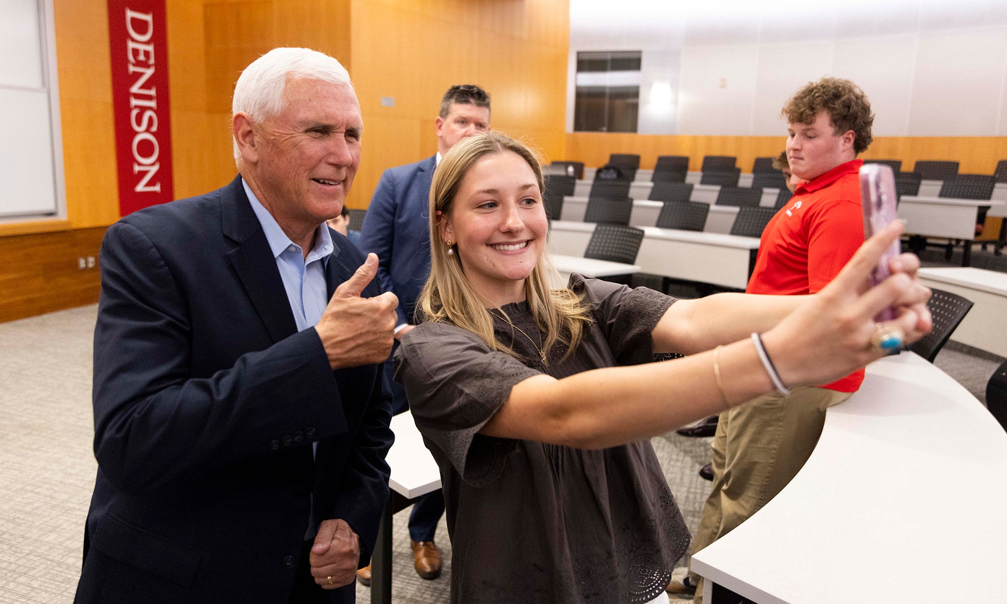 Vice President Mike Pence take a selfie with a student.